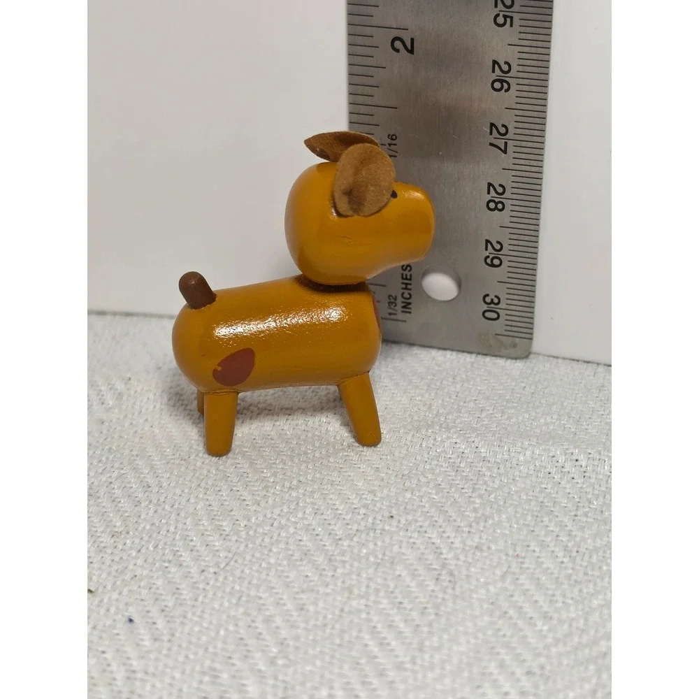 vintage 1960s dime store wooden dog figurine featuring leather ears and painted